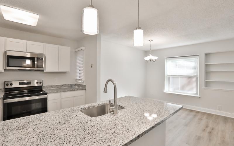 Spacious kitchens with thoughtful details a kitchen with a marble countertop